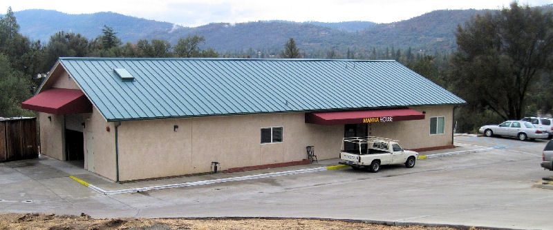 The Manna House building on Junction Drive, with the Sierra foothills behind it